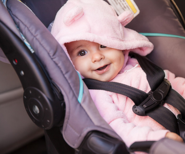 baby sitting in car seat