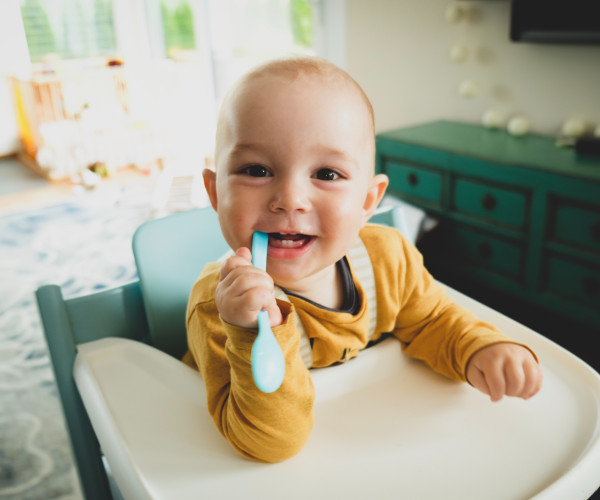 baby eating cereal